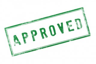 Rubber stamp saying 'Approved'